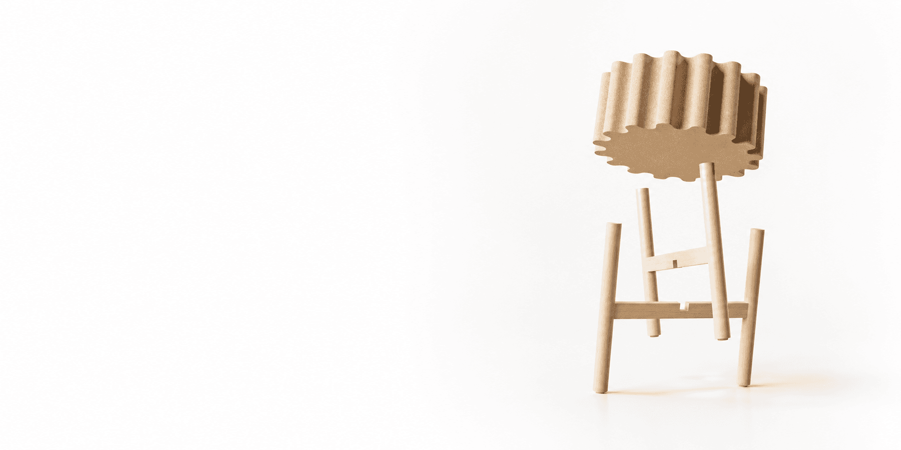 A fluted-top oak stool on splayed dowel legs